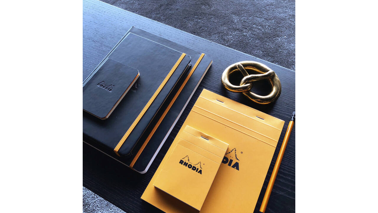 Schrijfblok Rhodia A5 lijn 80 vel 80gr met kantlijn oranje