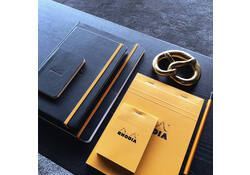 Schrijfblok Rhodia A5 lijn 80 vel 80gr met kantlijn oranje